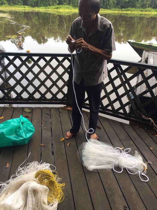 Local elder Arbu lent us his nets and taught us his techniques for casting