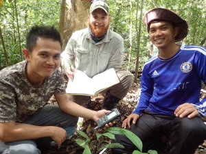 From left to right: Faijan, Phil and Amir using the soil pH and temperature meter OLYMPUS DIGITAL CAMERA